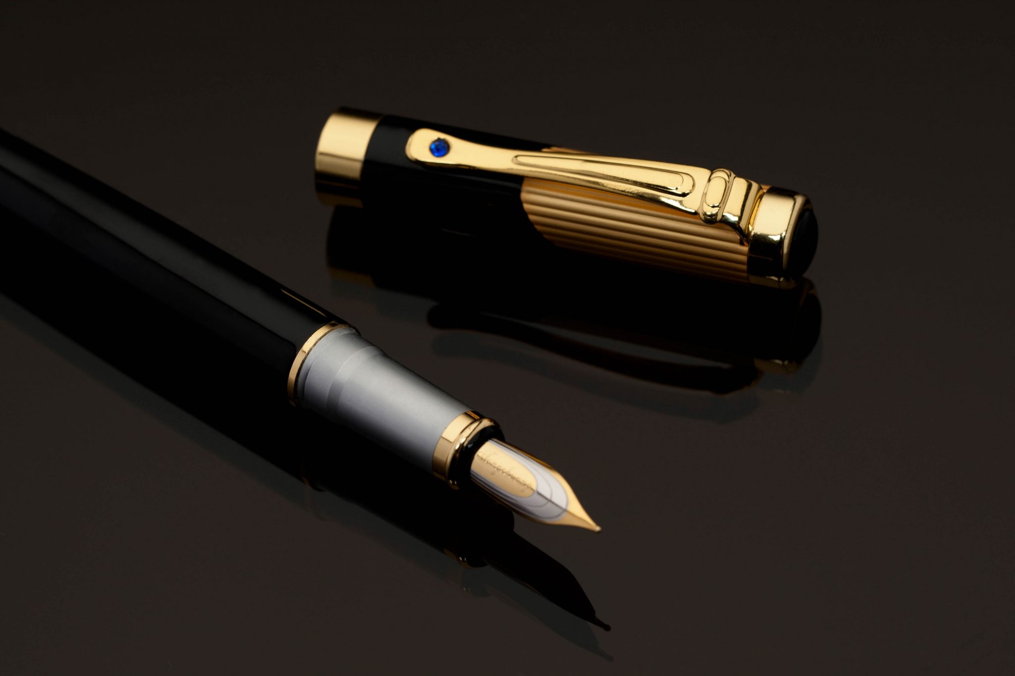 Commercial photo of a gold tipped fountain pen